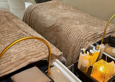 A cozy treatment area at Head Space Manchester featuring plush beds and beauty products. Located in Manchester, England, GB.