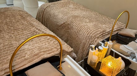 A cozy treatment area at Head Space Manchester featuring plush beds and beauty products. Located in Manchester, England, GB.