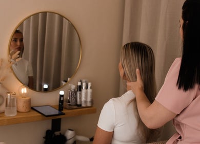 Stylist works with client's hair at Head Space Manchester, cozy setup in Manchester, England, GB.