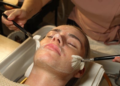 Facial treatment at Head Space Manchester, Manchester, England, GB, showing a soothing beauty brush application.
