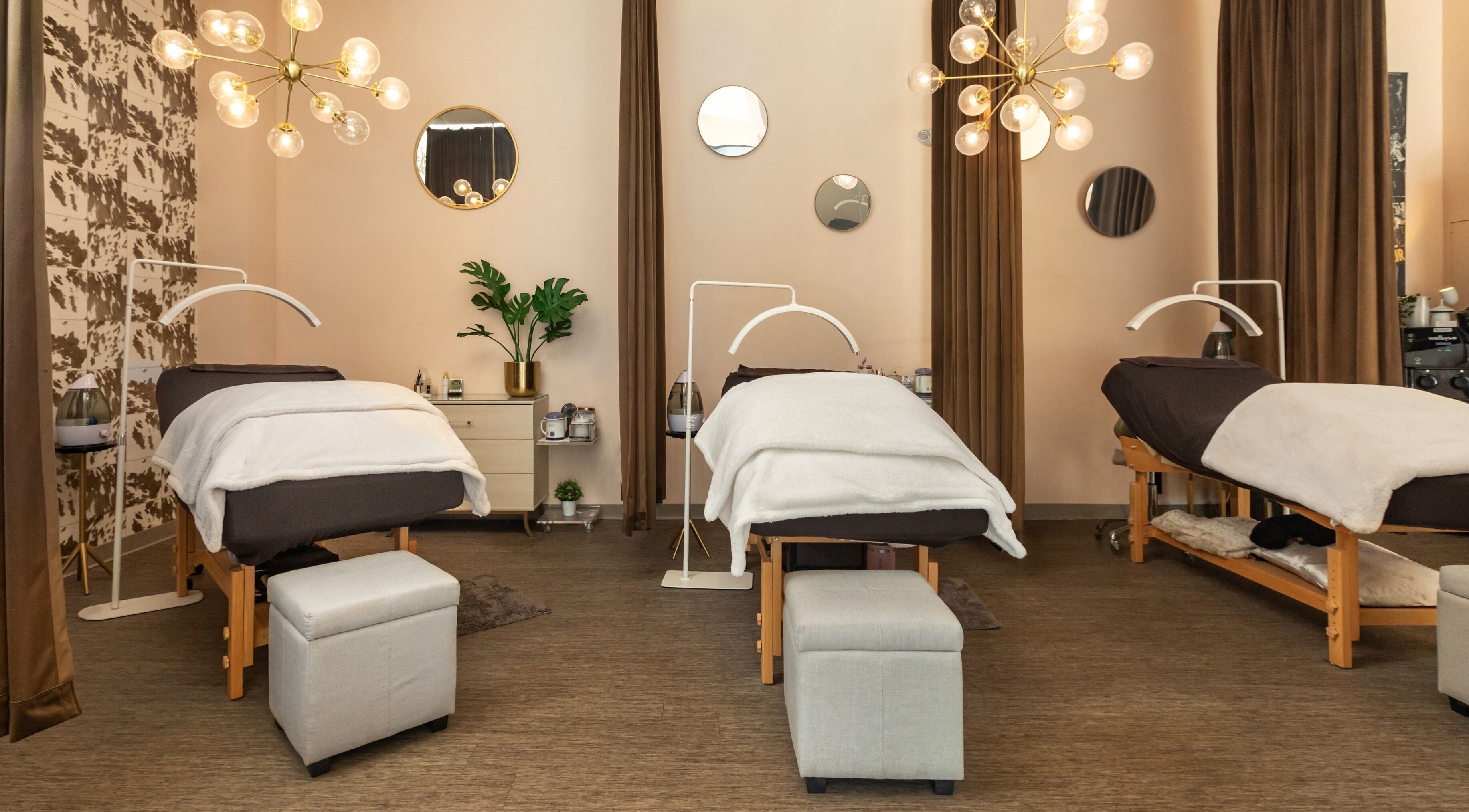 Elegant spa room at Hanover Lash Lady in Hanover, Massachusetts, US with luxurious treatment beds and chic decor.