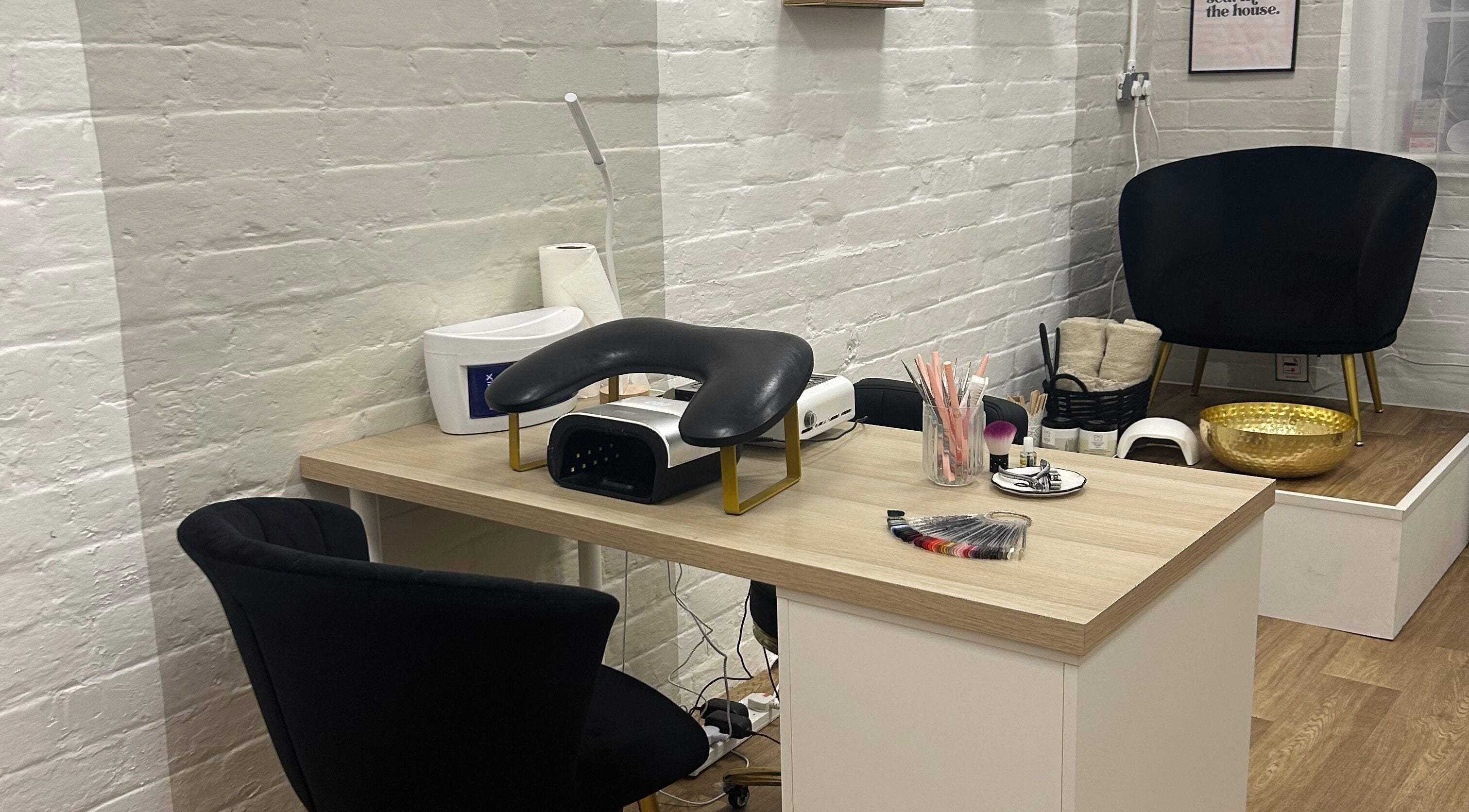 Nail table and seating area at Mayde Beauty Studio, Hinckley, England, GB, offering a serene spa experience.