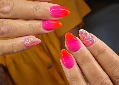 Bright pink and orange nails with glitter at Nails By Kaili-Jade, Nuneaton, England, GB.