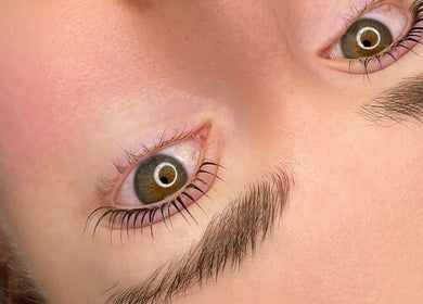 Close-up of well-groomed eyebrows and eyelashes at Koi Beauty Oxford, Oxford, England, GB.