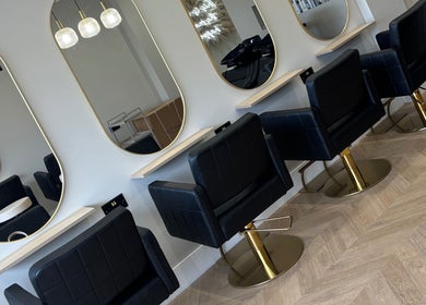 Elegant styling chairs and mirrors at Nevada Hair Studio, Edinburgh, Scotland, GB, showcasing modern design.