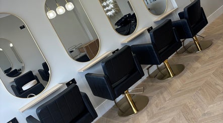 Elegant styling chairs and mirrors at Nevada Hair Studio, Edinburgh, Scotland, GB, showcasing modern design.