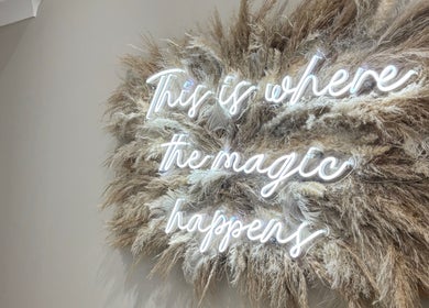 Neon sign 'This is where the magic happens' at Nevada Hair Studio, Edinburgh, Scotland, GB.