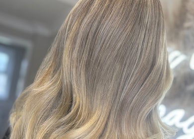 Elegant wavy blonde hairstyle at Nevada Hair Studio, Edinburgh, Scotland, GB.