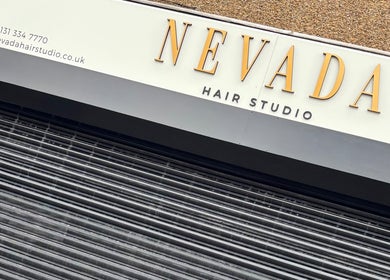 Nevada Hair Studio facade in Edinburgh, Scotland, GB, showcasing elegant signage.
