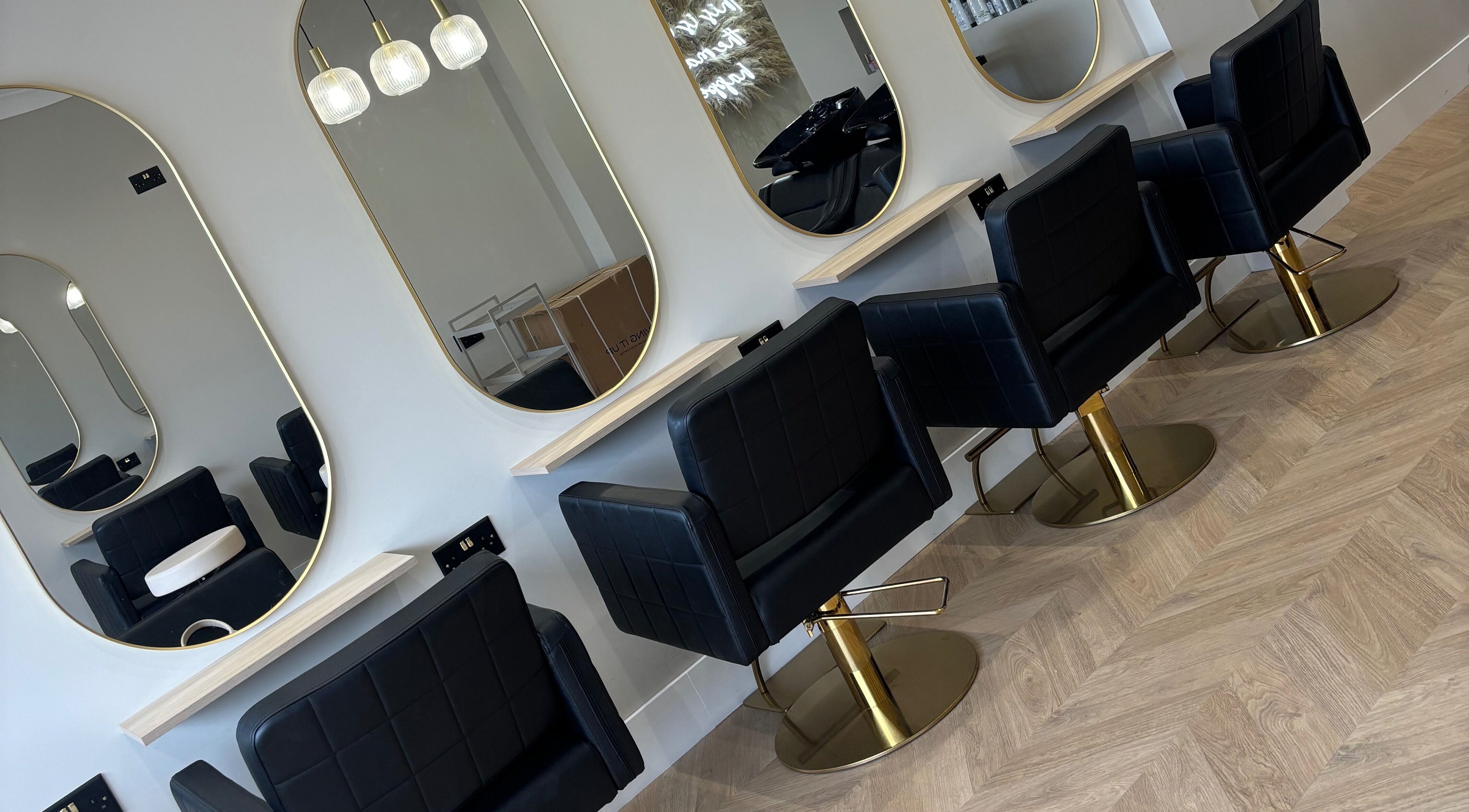 Elegant salon chairs and mirrors at Nevada Hair Studio in Edinburgh, Scotland, GB.