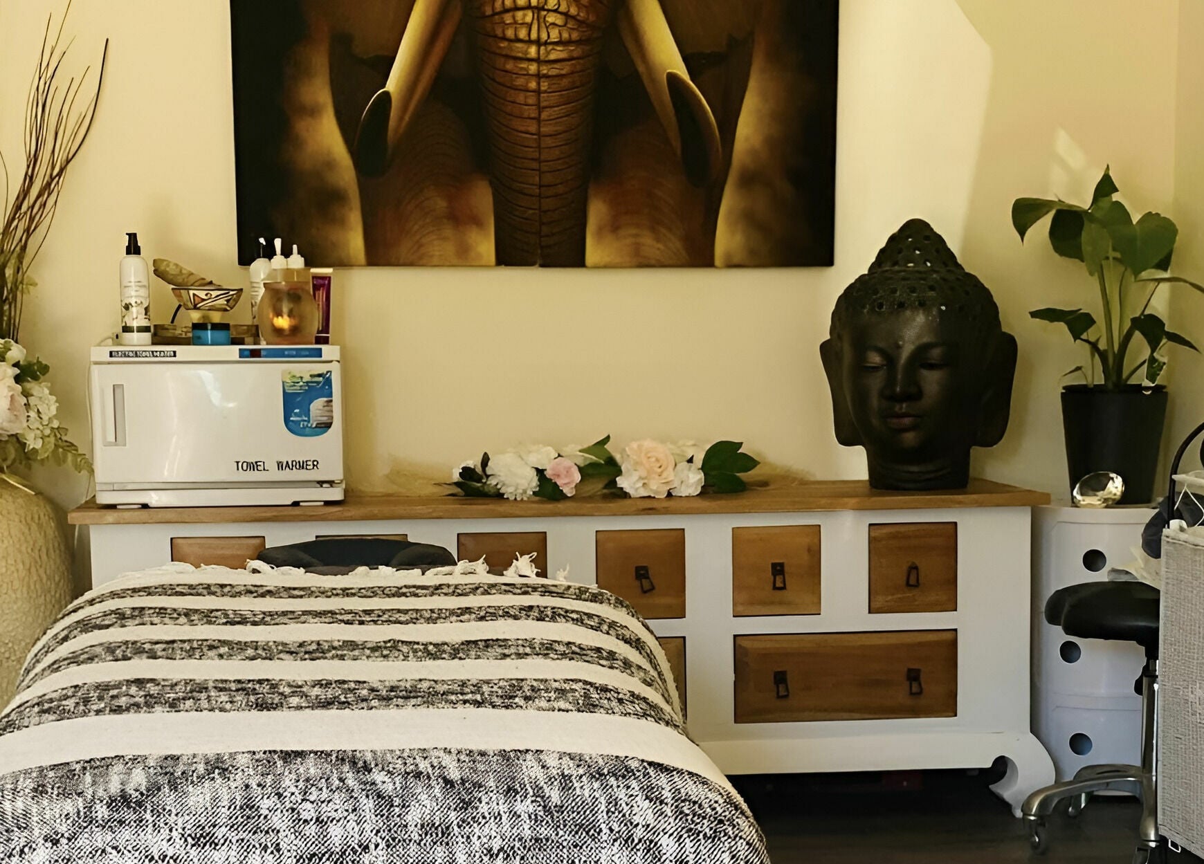 Relaxing massage room at Essentially U Massage, New South Wales, AU featuring decor and a comfortable massage bed.