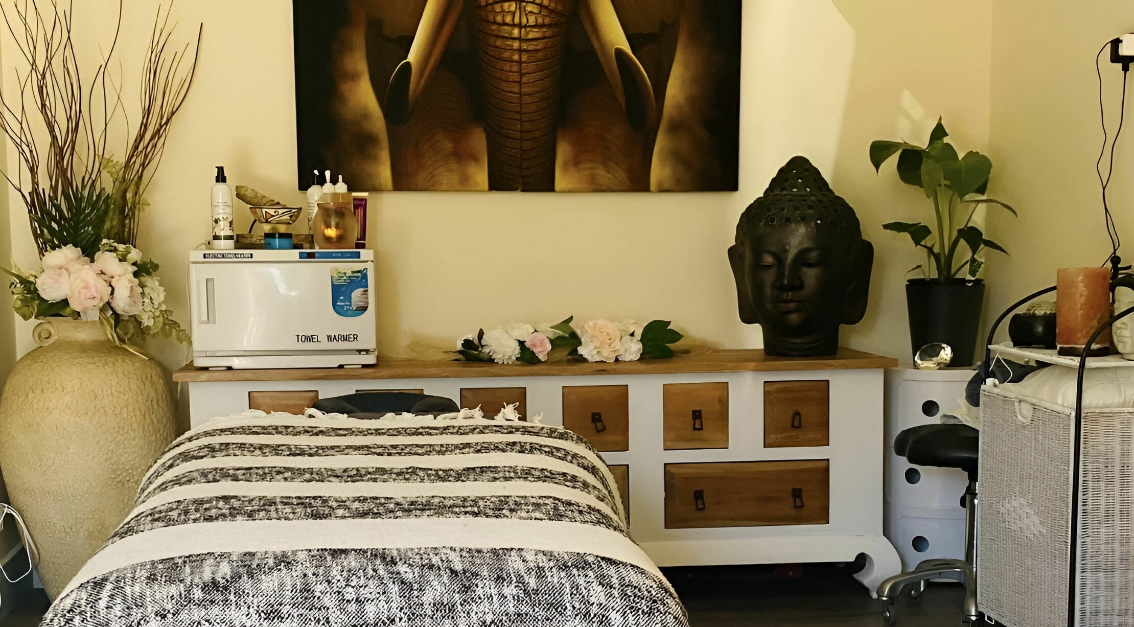 Relaxing massage room at Essentially U Massage, New South Wales, AU featuring decor and a comfortable massage bed.