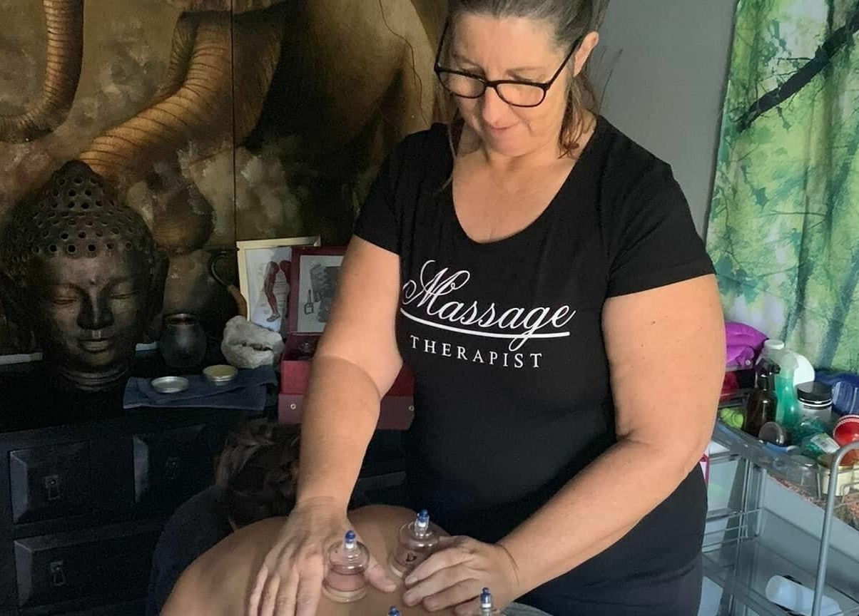 A therapist performing a cupping massage at Essentially U Massage, New South Wales, New South Wales, AU.