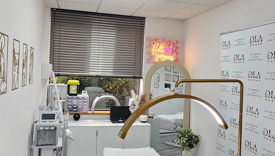 A modern treatment room at Diamond Luxe Aesthetics, Uxbridge, England, GB, featuring stylish decor and high-tech equipment.