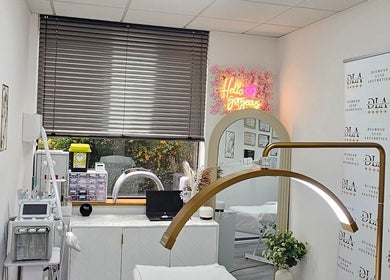 Elegant treatment room at Diamond Luxe Aesthetics, Uxbridge, England, GB with modern equipment and stylish decor.