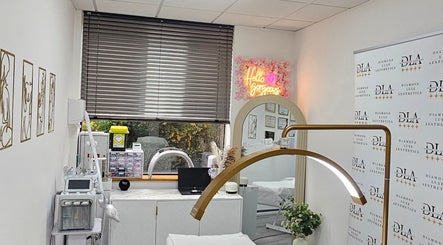 Elegant treatment room at Diamond Luxe Aesthetics, Uxbridge, England, GB with modern equipment and stylish decor.