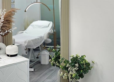 Elegant treatment room at Diamond Luxe Aesthetics, Uxbridge, England, GB, showcasing modern decor and comfort.