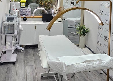 Elegant treatment room at Diamond Luxe Aesthetics, Uxbridge, England, GB, featuring modern equipment.