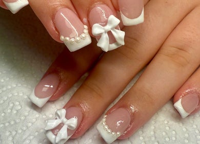 Stylish nails with bows and pearls at pnail_studio, Balbriggan, County Dublin, IE.