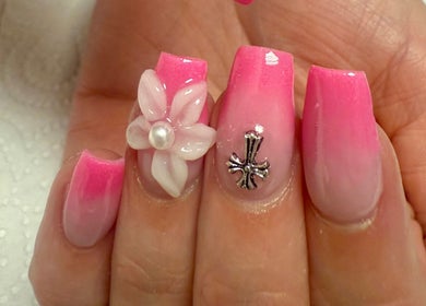 Elegant pink nails with floral and cross designs at pnail_studio, Balbriggan, County Dublin, IE.