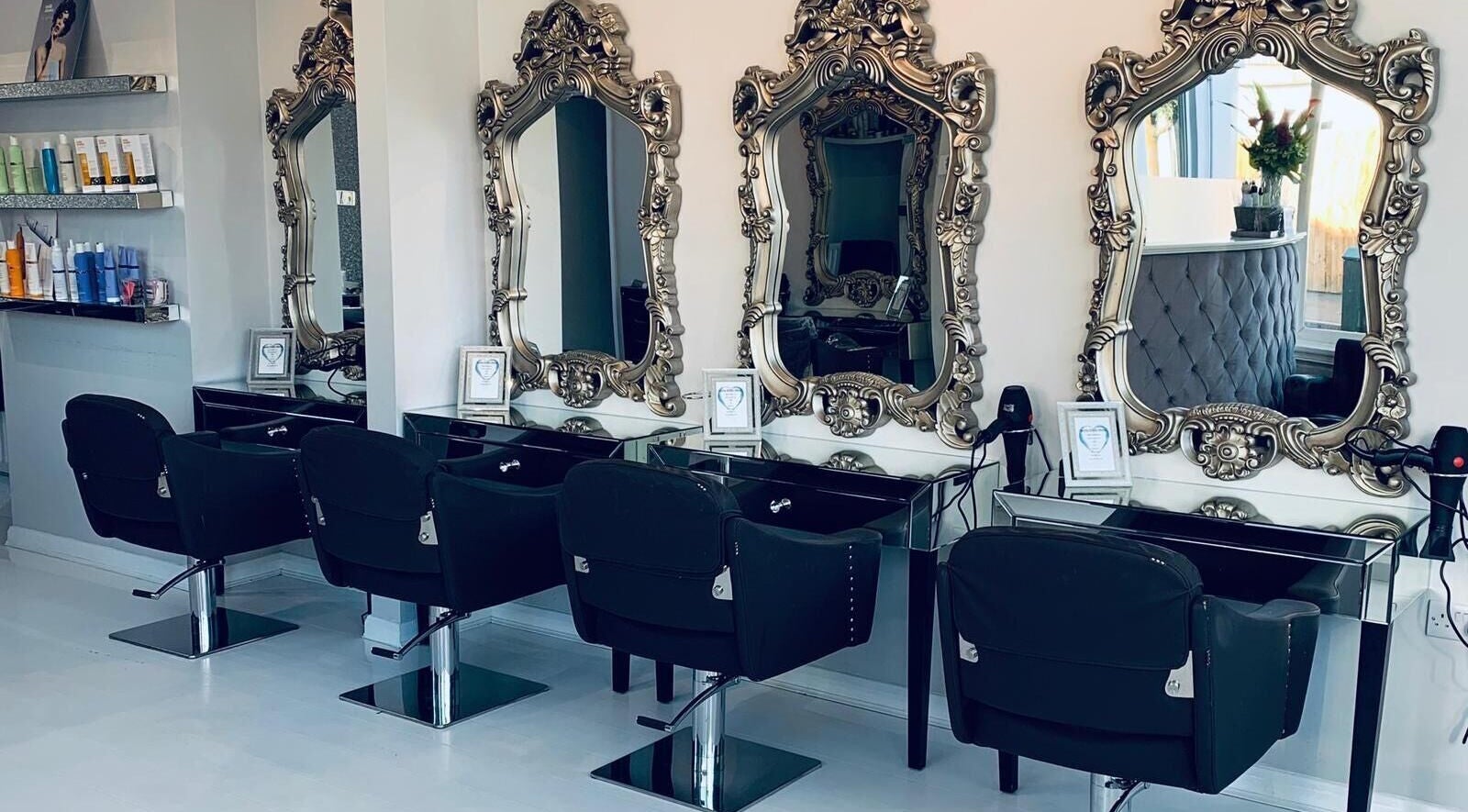 Luxurious mirrors at Vanity Hair And Beauty Salon, Feltham, England, GB showcasing sophisticated styling stations.
