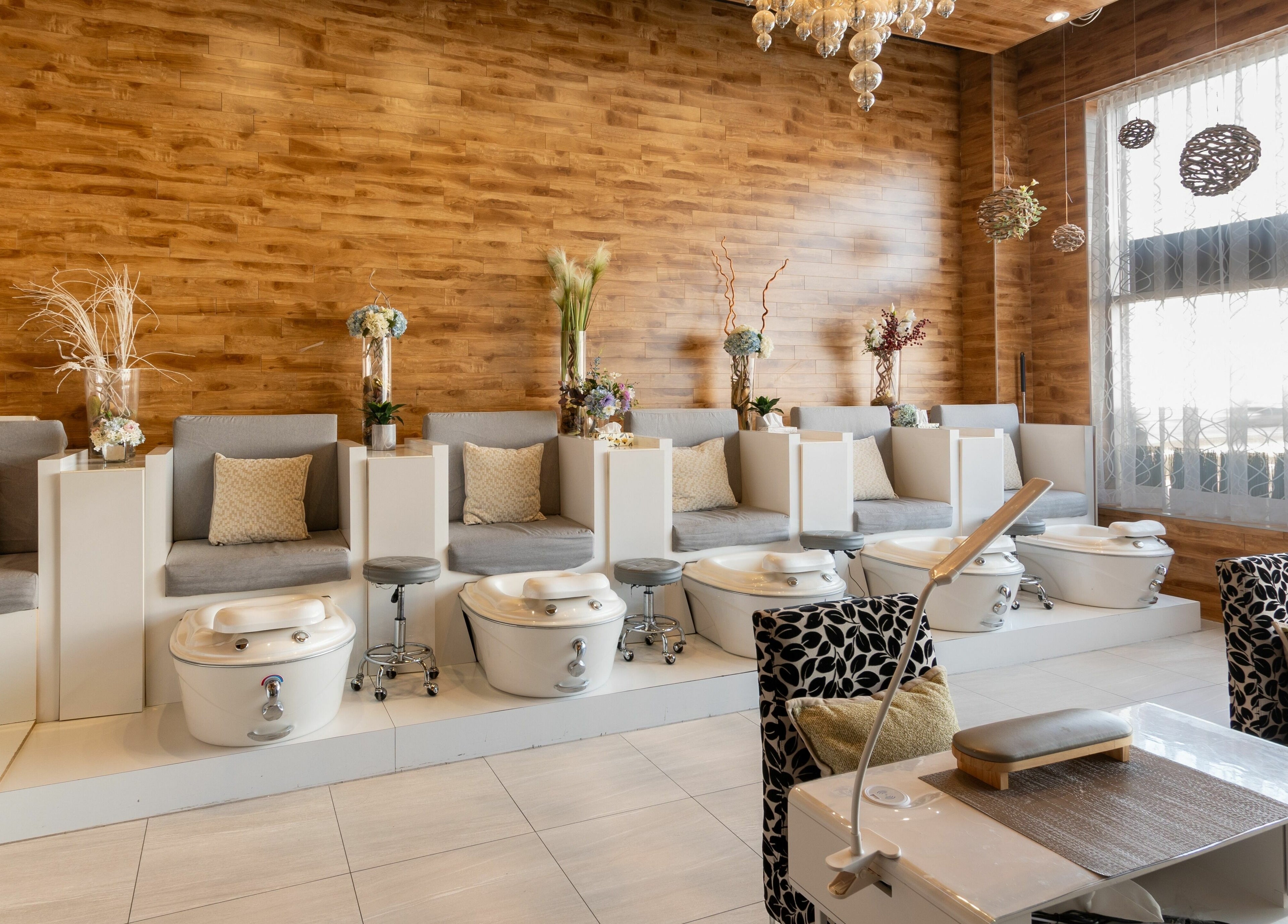 Pedicure chairs in Aroma Day Spa, Markham, Ontario, CA offering a relaxing ambiance with elegant decor.