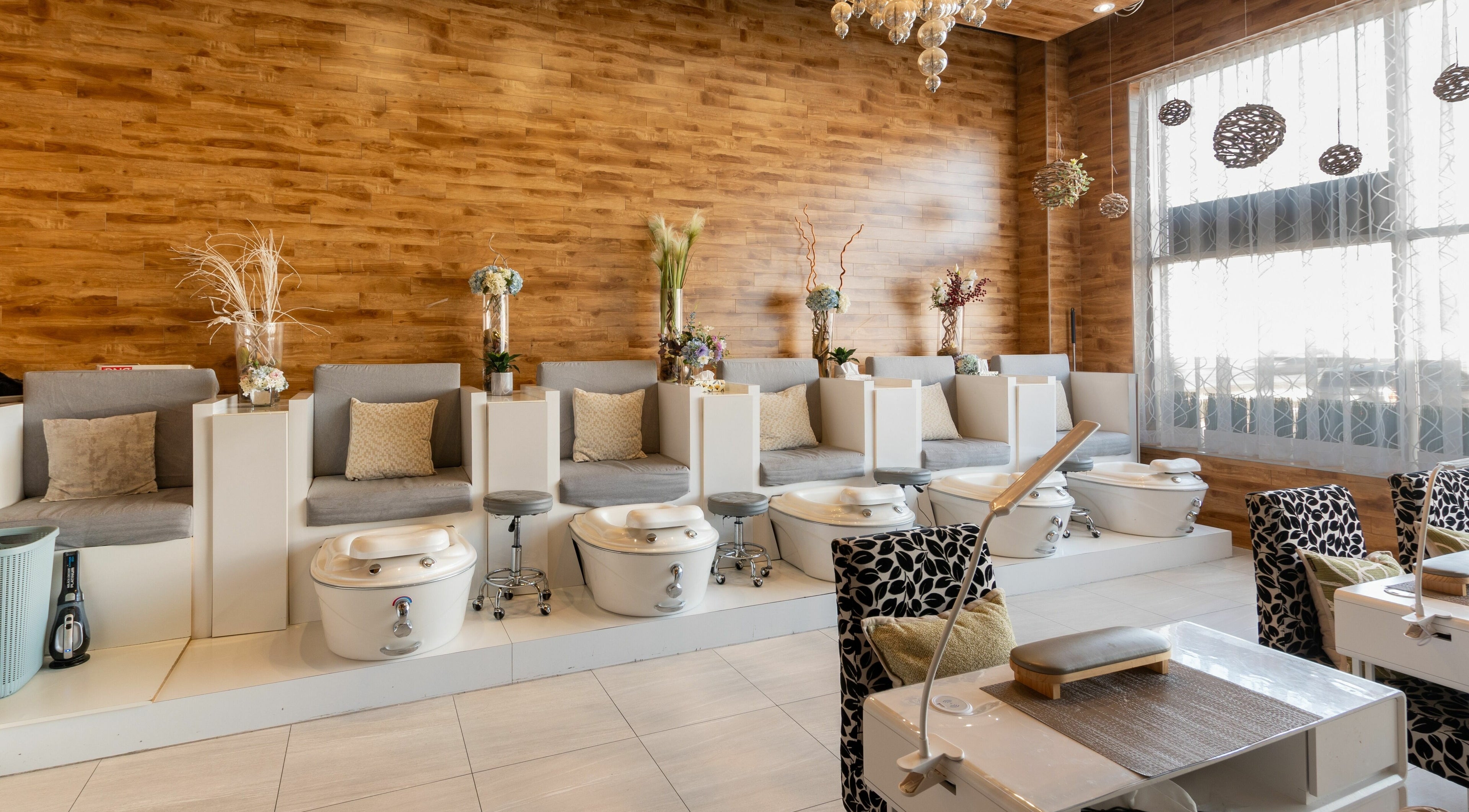 Pedicure chairs in Aroma Day Spa, Markham, Ontario, CA offering a relaxing ambiance with elegant decor.