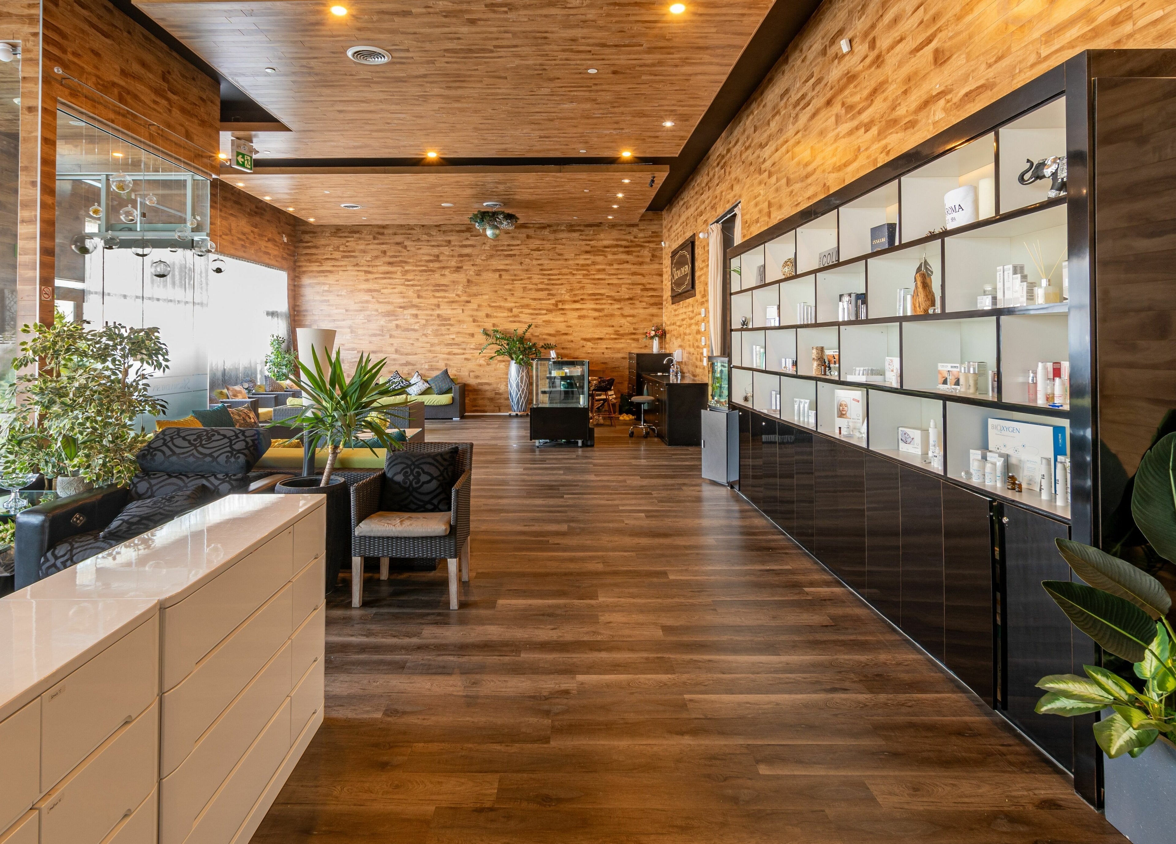 Elegant interior of Aroma Day Spa in Markham, Ontario, CA featuring modern decor and lush plants.