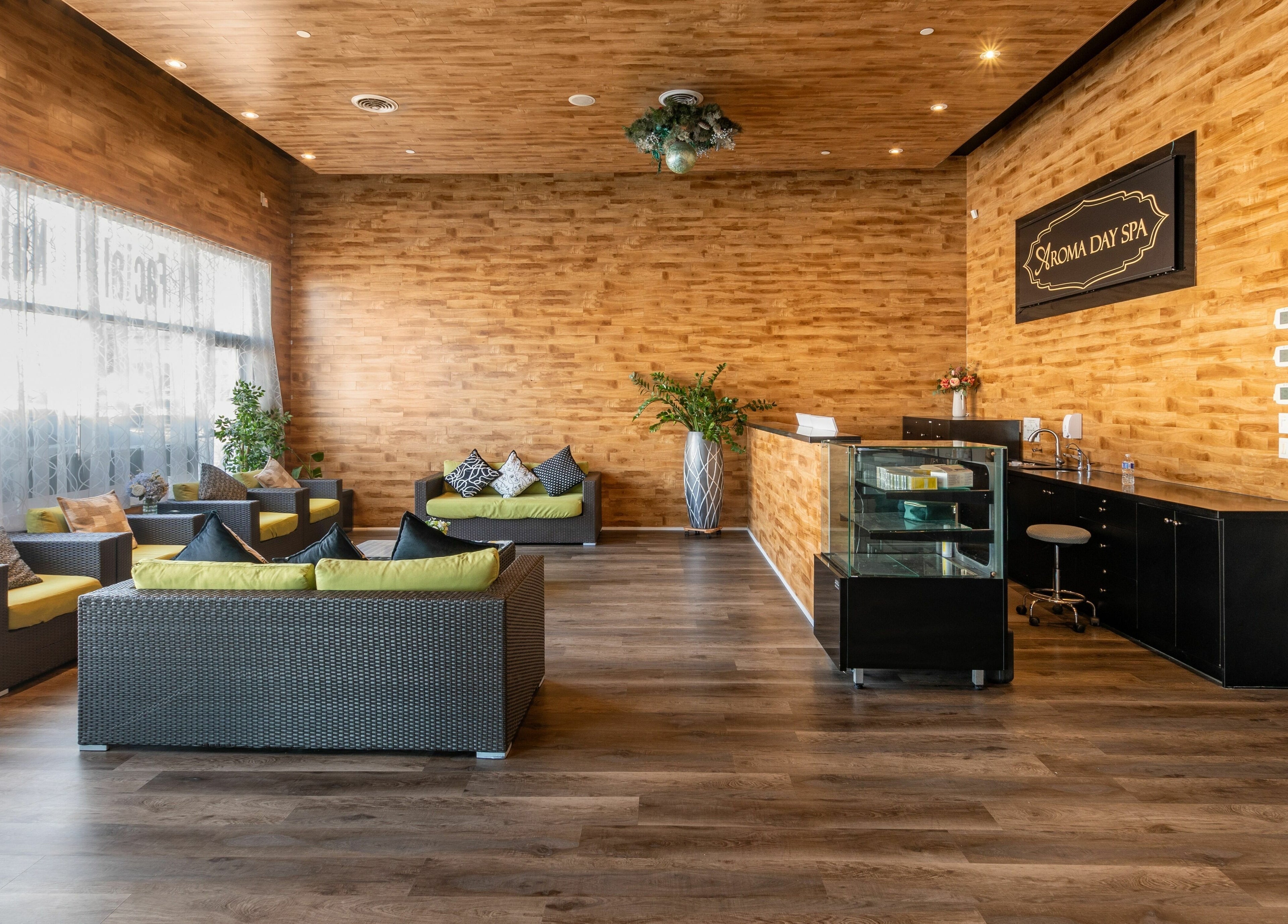 Relaxing seating area at Aroma Day Spa, Markham, Ontario, CA featuring cozy armchairs and warm decor.