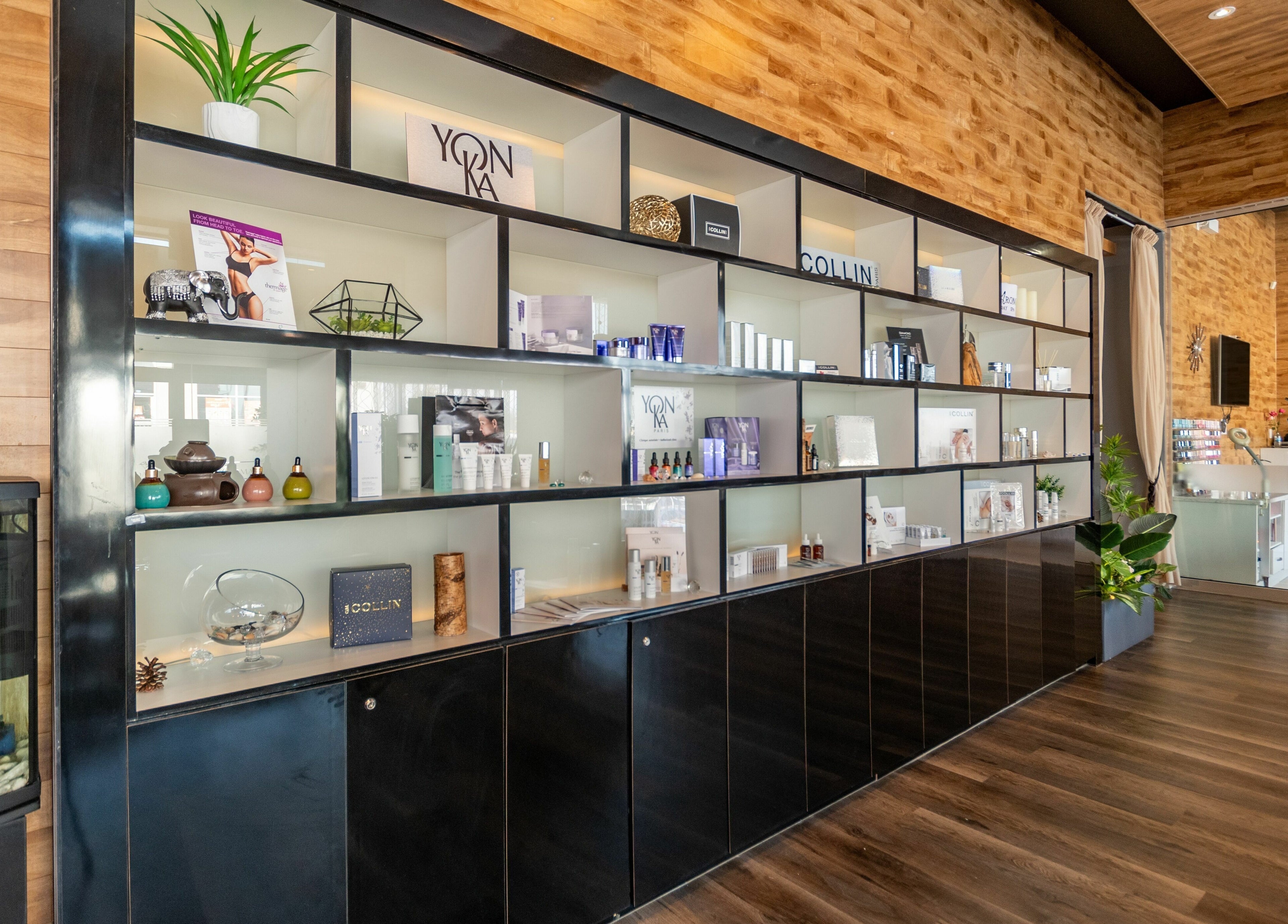 Modern product display at Aroma Day Spa, Markham, Ontario, CA, showcasing beauty items in a sleek, inviting setting.