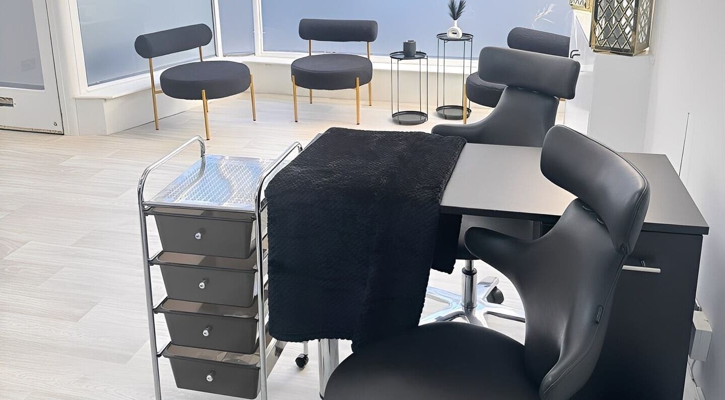 Modern nail salon setup at Empire Beauty, Scarborough, England, GB with sleek black chairs and stylish decor.