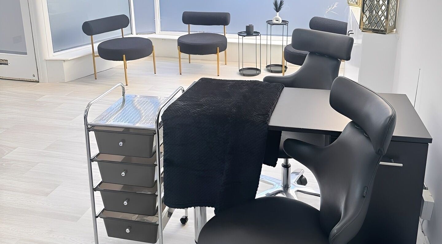 Modern nail salon setup at Empire Beauty, Scarborough, England, GB with sleek black chairs and stylish decor.