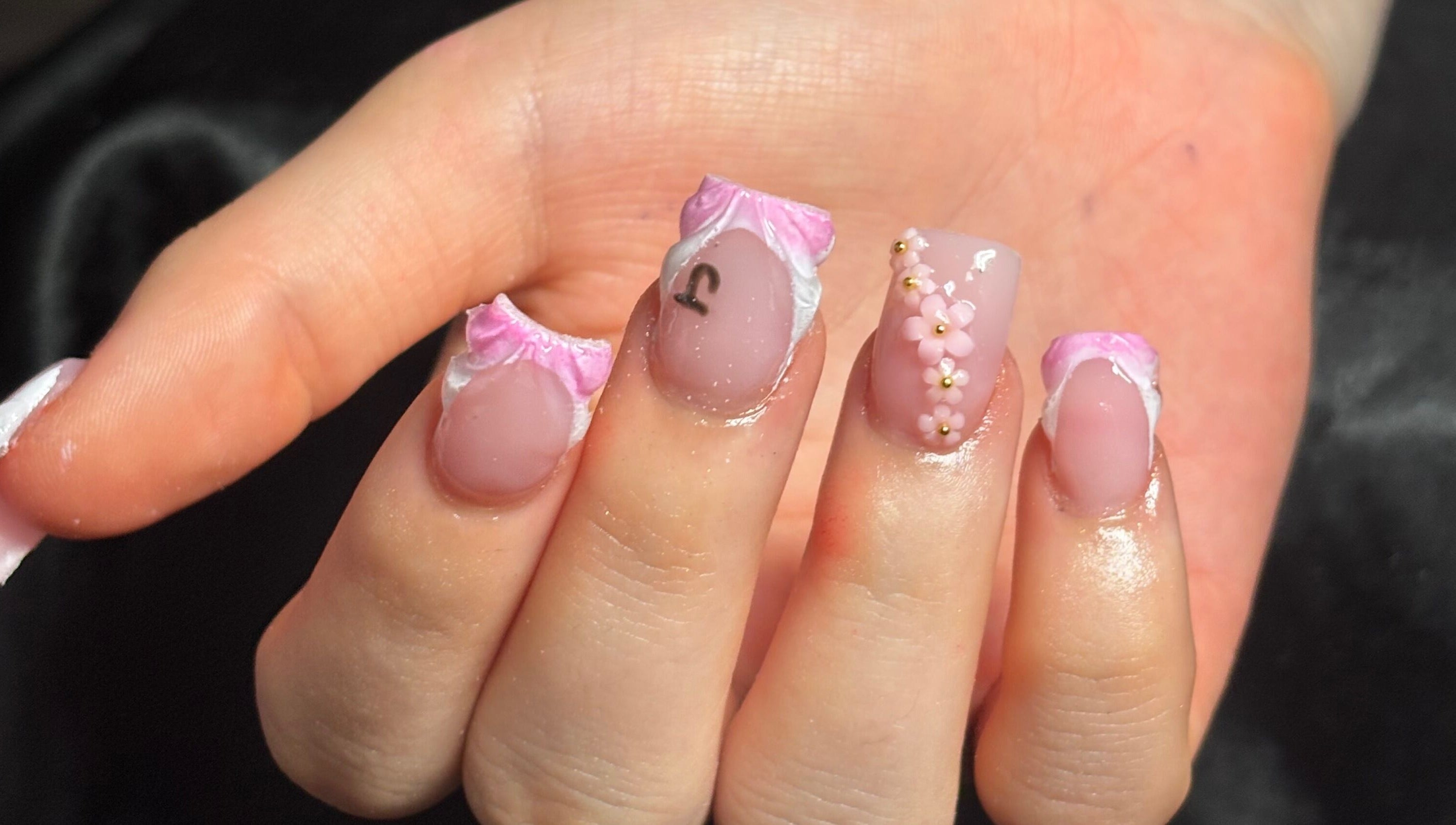 Elegant nail art with pink flowers at Nailsby.Ls, Bromley, England, GB.