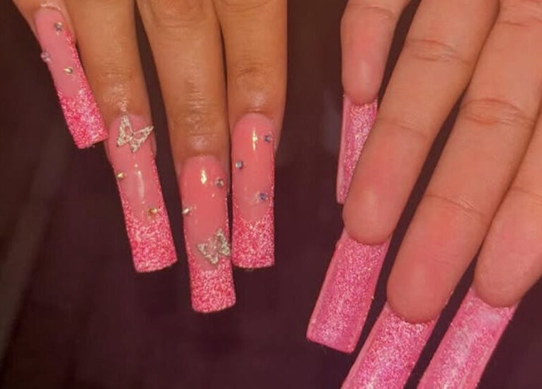 Elegant pink glitter nails with butterfly design by Nailsby.Ls in Bromley, England, GB.