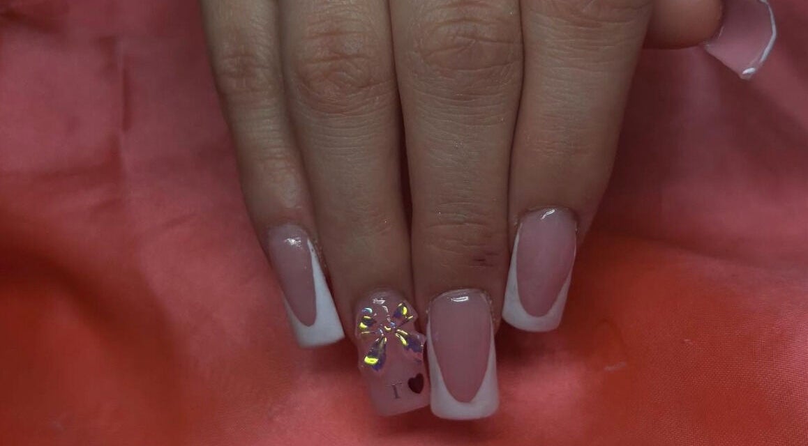 Elegant French manicure with bow detail at Nailsby.Ls, Bromley, England, GB.