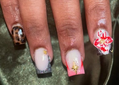 Stylish nail art at Nailsby.Ls in Bromley, England, GB, featuring vibrant floral and leopard patterns.