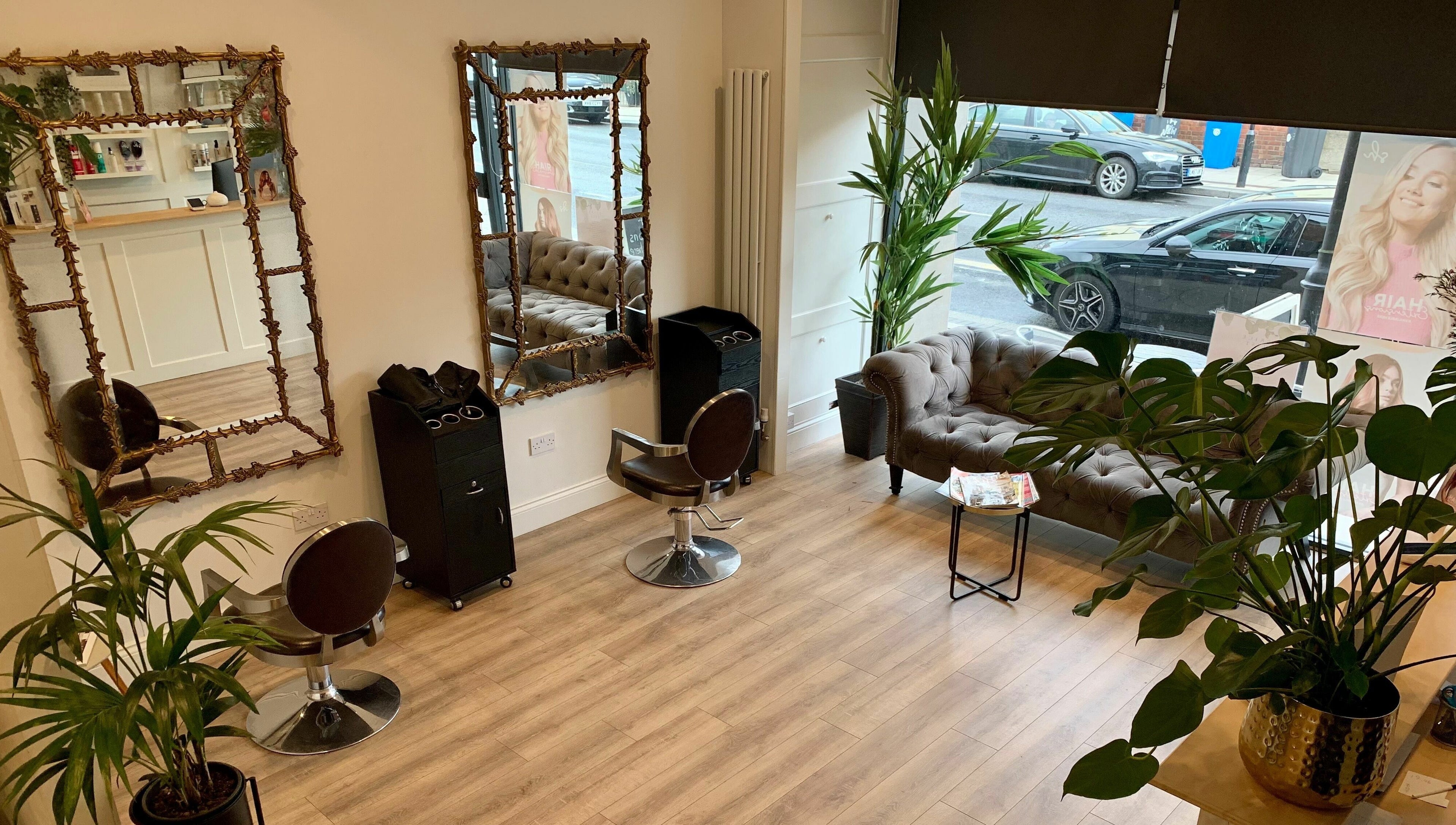 Elegant interior of Dandy Hair, Hull, England, GB with luxurious seating and stylish mirrors.