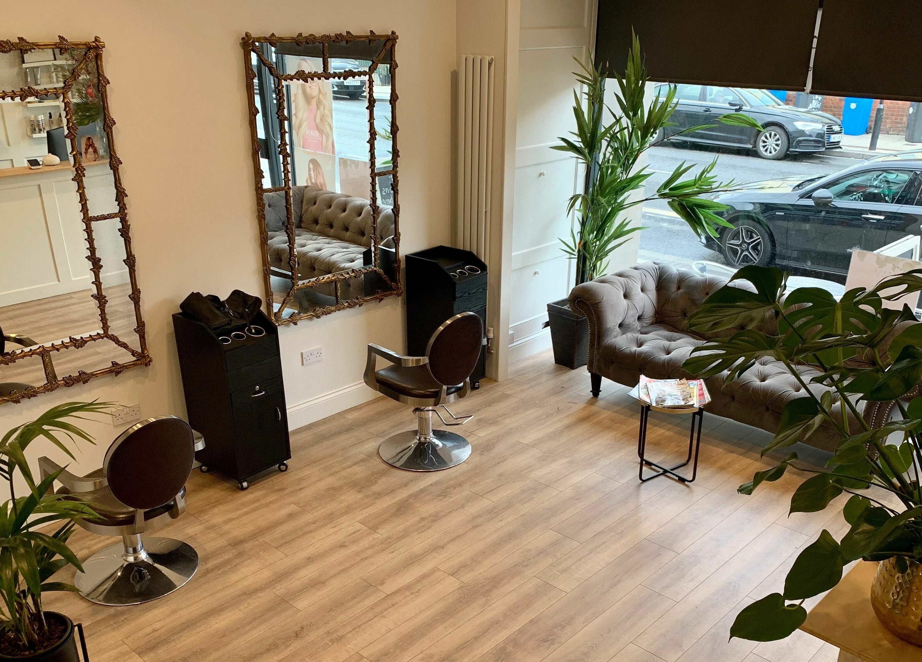Elegant interior of Dandy Hair, Hull, England, GB with luxurious seating and stylish mirrors.