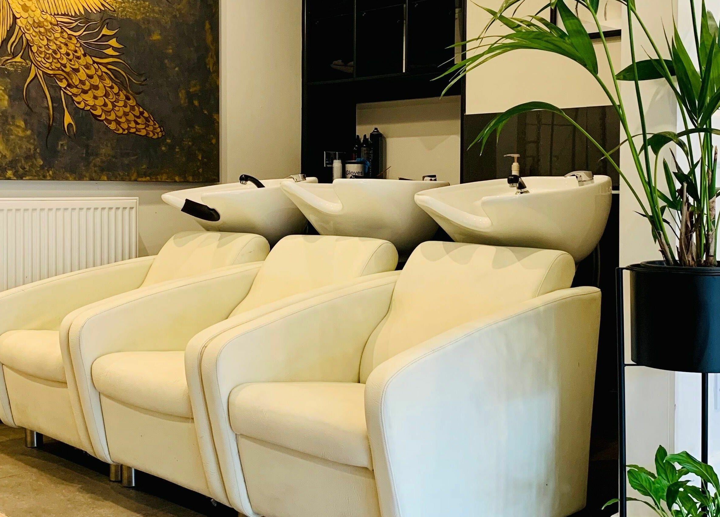Luxurious wash stations at Dandy Hair, Hull, England, GB with elegant seating and vibrant decor.