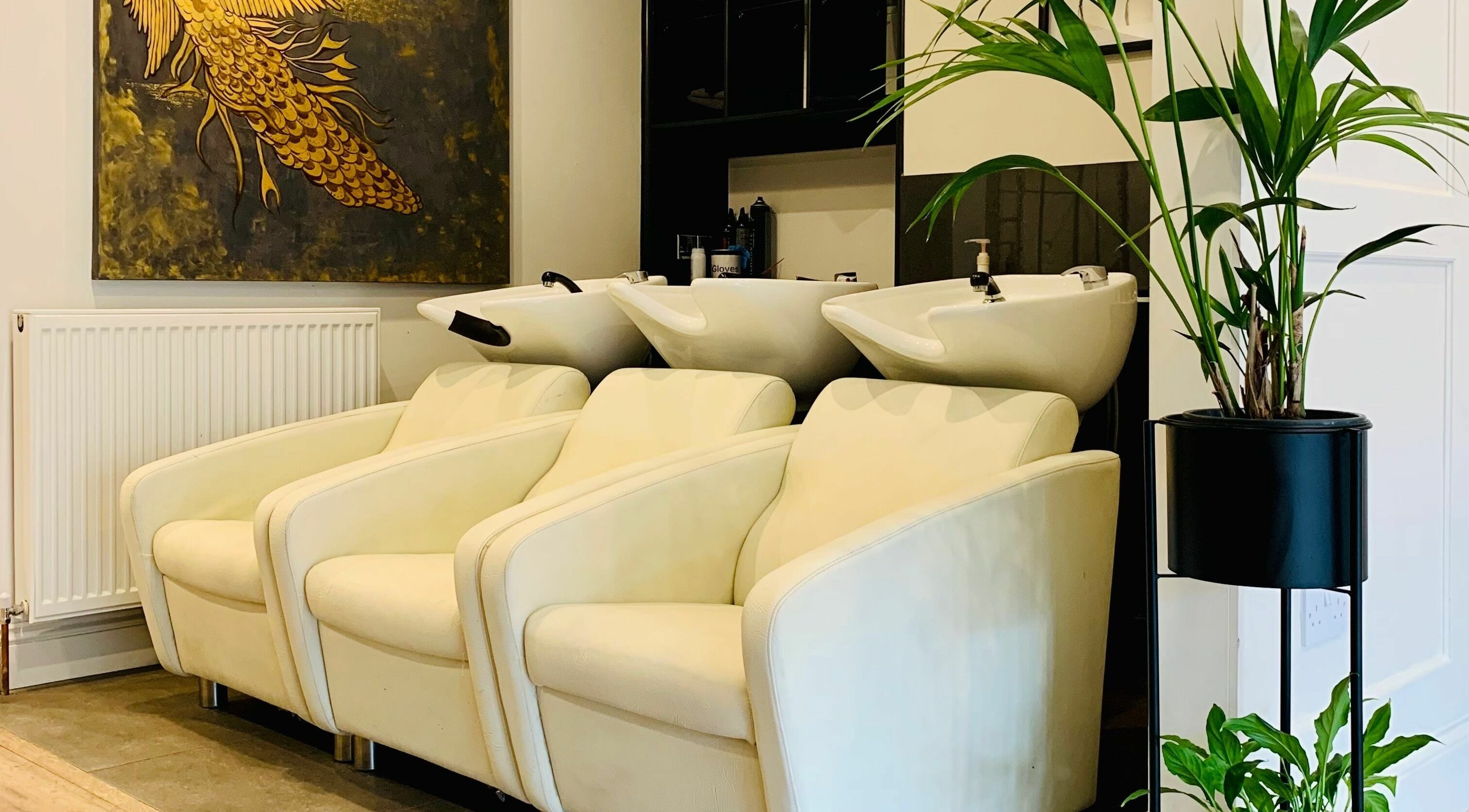 Luxurious wash stations at Dandy Hair, Hull, England, GB with elegant seating and vibrant decor.