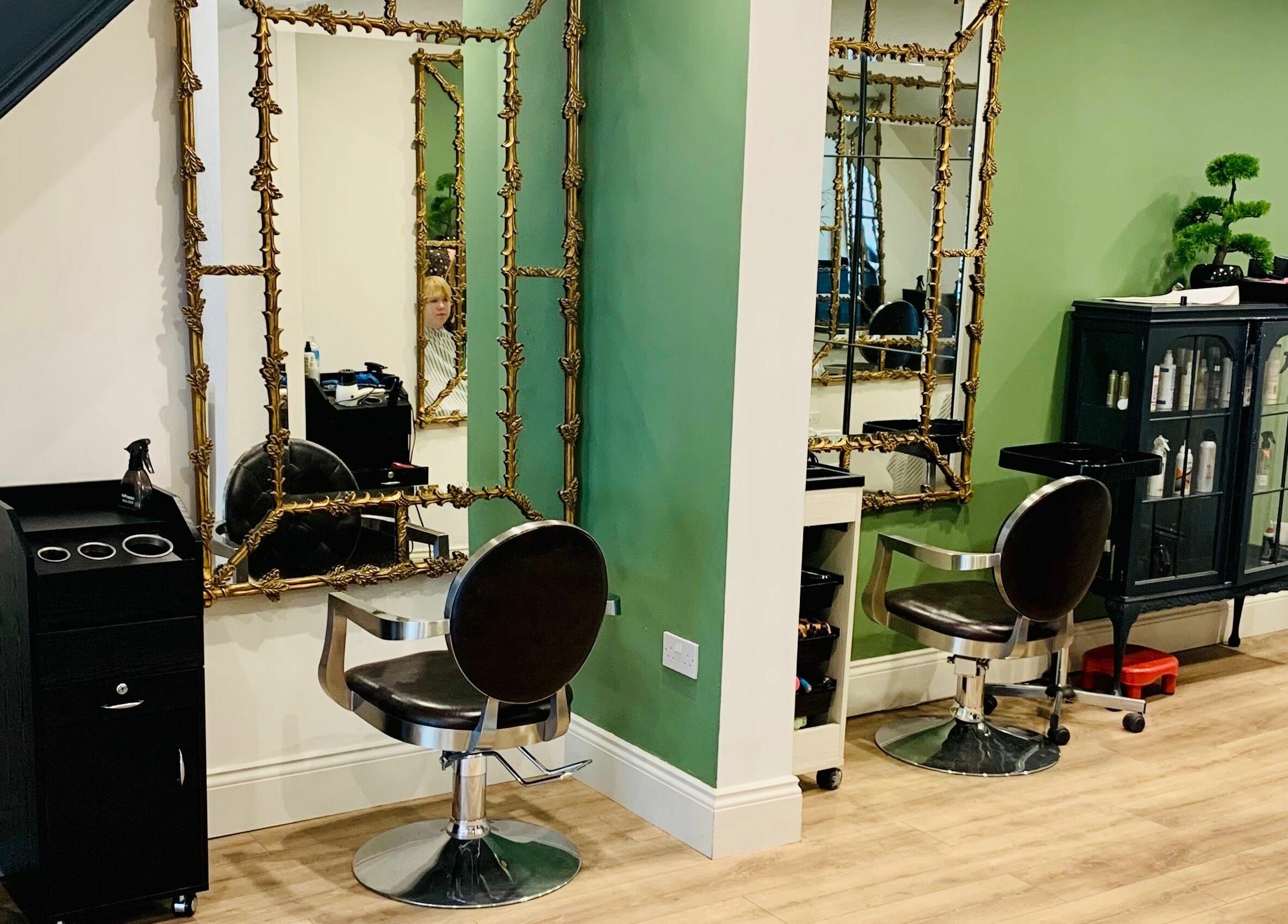 Stylish interior of Dandy Hair, Hull, England, GB with chic mirrors and seating.