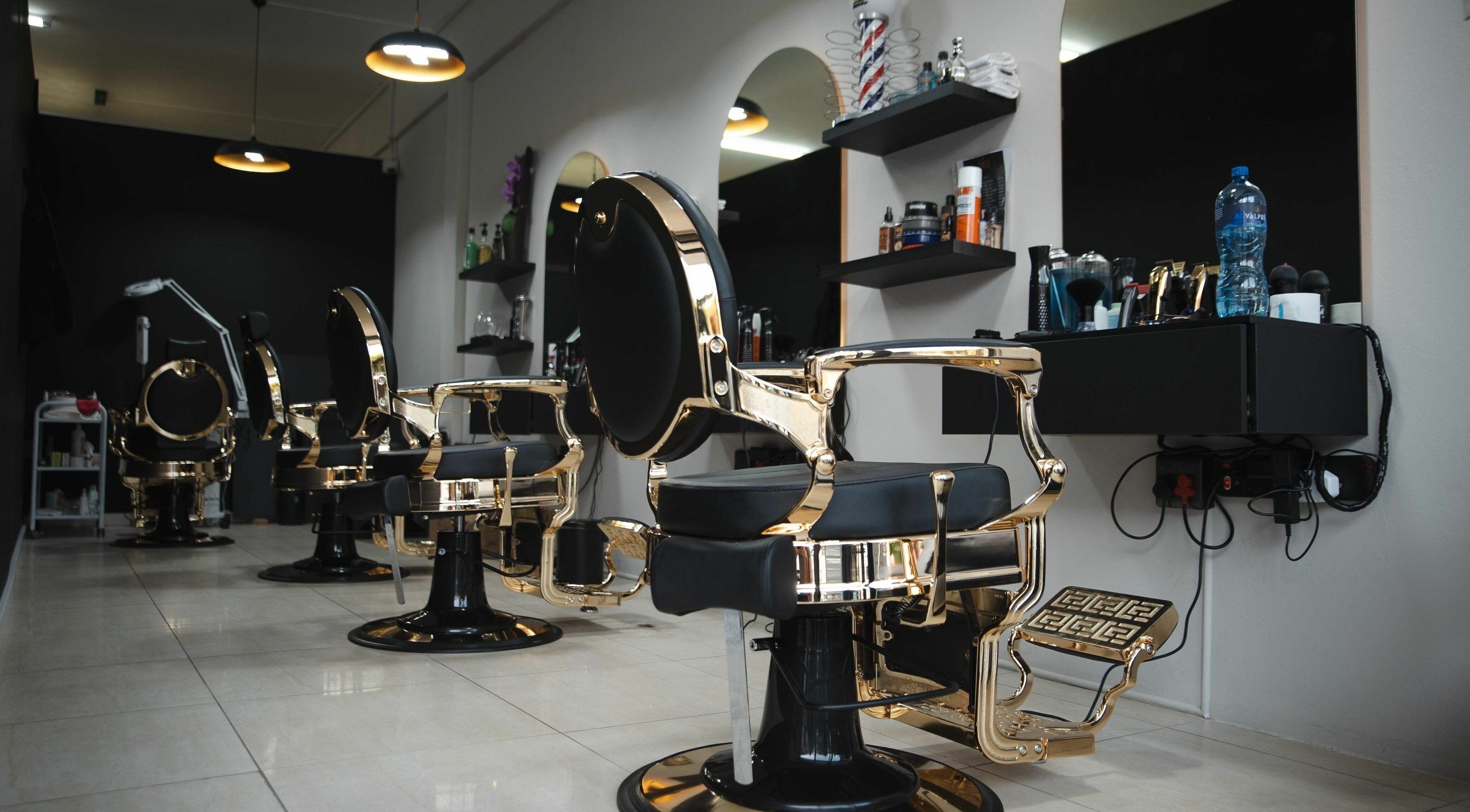 Luxurious salon interior with gold-trimmed chairs at Mkh Beauty House, Johannesburg, Gauteng, ZA.