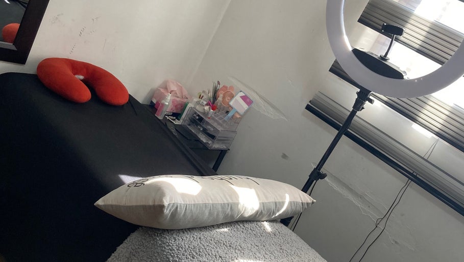 Comfortable treatment area at SK Nail and Beauty Bar in Soweto, Gauteng, ZA with a massage bed and a ring light.
