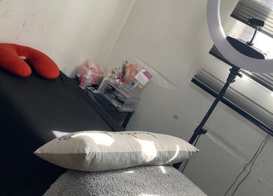 Comfortable treatment area at SK Nail and Beauty Bar in Soweto, Gauteng, ZA with a massage bed and a ring light.