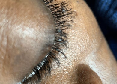 Close-up of expertly done eyelashes at SK Nail and Beauty Bar, Soweto, Gauteng, ZA.