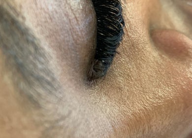 Closeup of expertly applied lashes at SK Nail and Beauty Bar, Soweto, Gauteng, ZA.