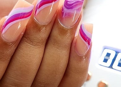 Stylish pink and purple nail design at KiKi Beauty Spot, Portmore, St. Catherine Parish, JM.