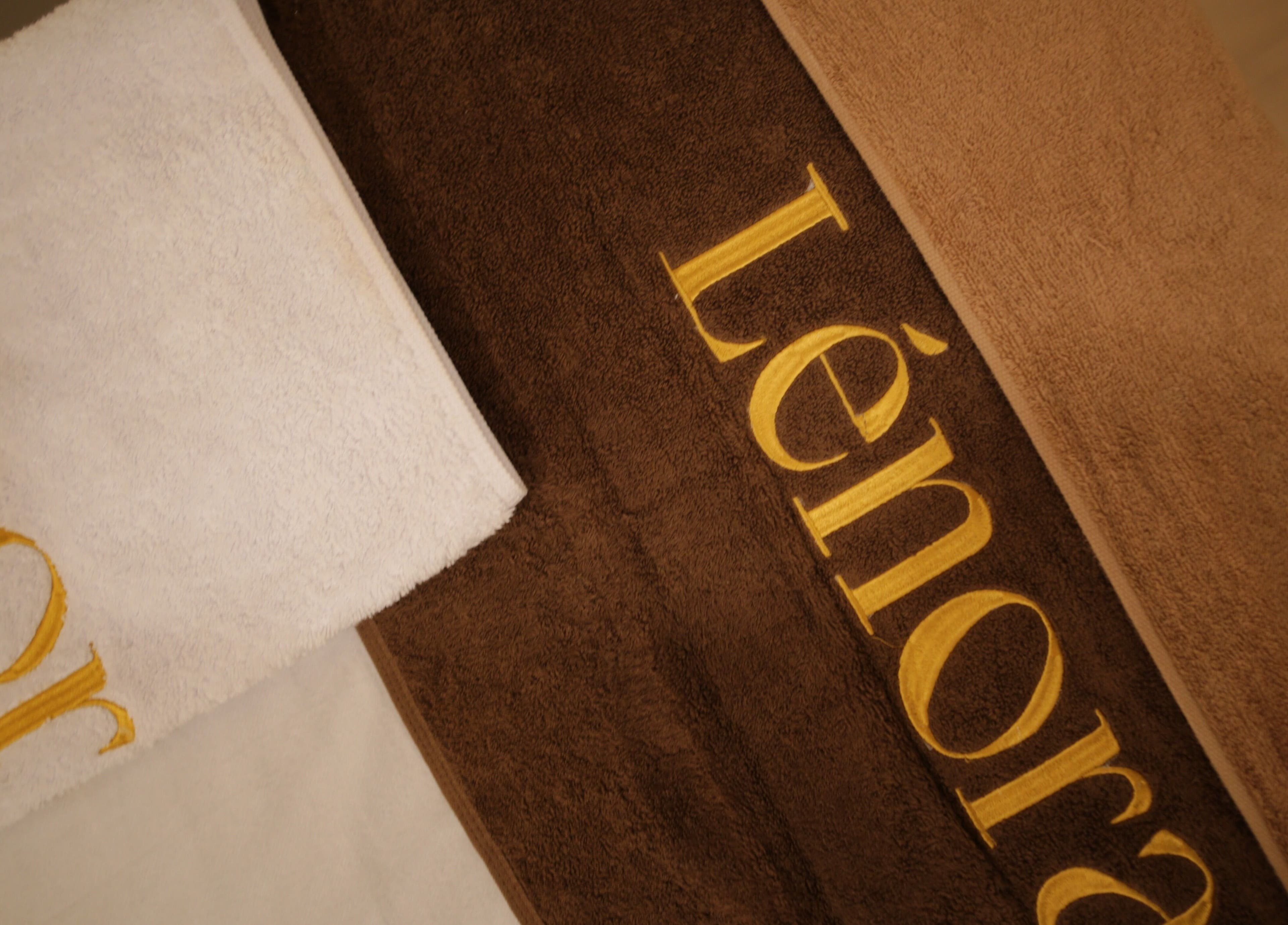 LENORA BEAUTY STUDIO towels in soft browns, Bali, Bali, ID. Luxurious spa ambiance captured.