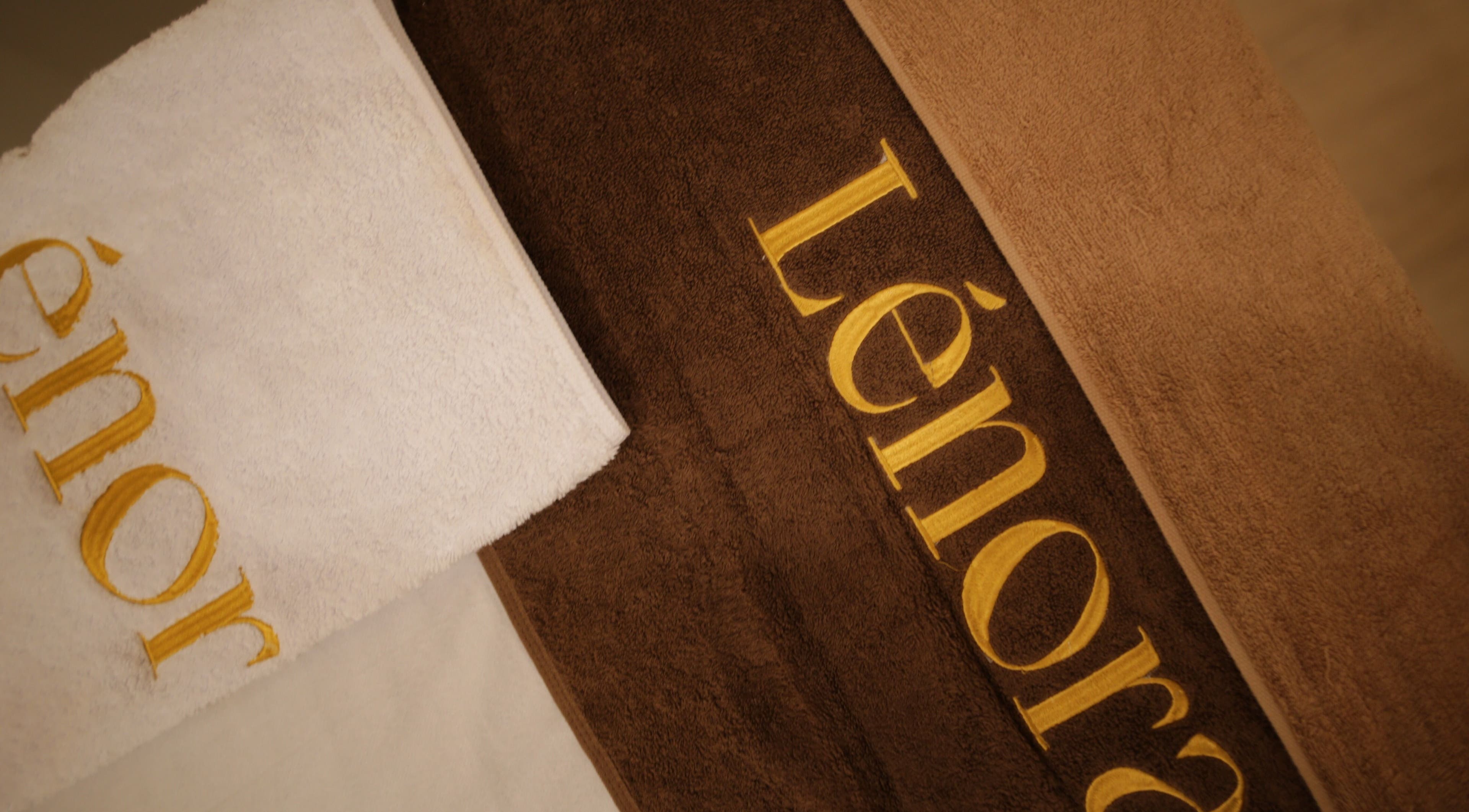 LENORA BEAUTY STUDIO towels in soft browns, Bali, Bali, ID. Luxurious spa ambiance captured.