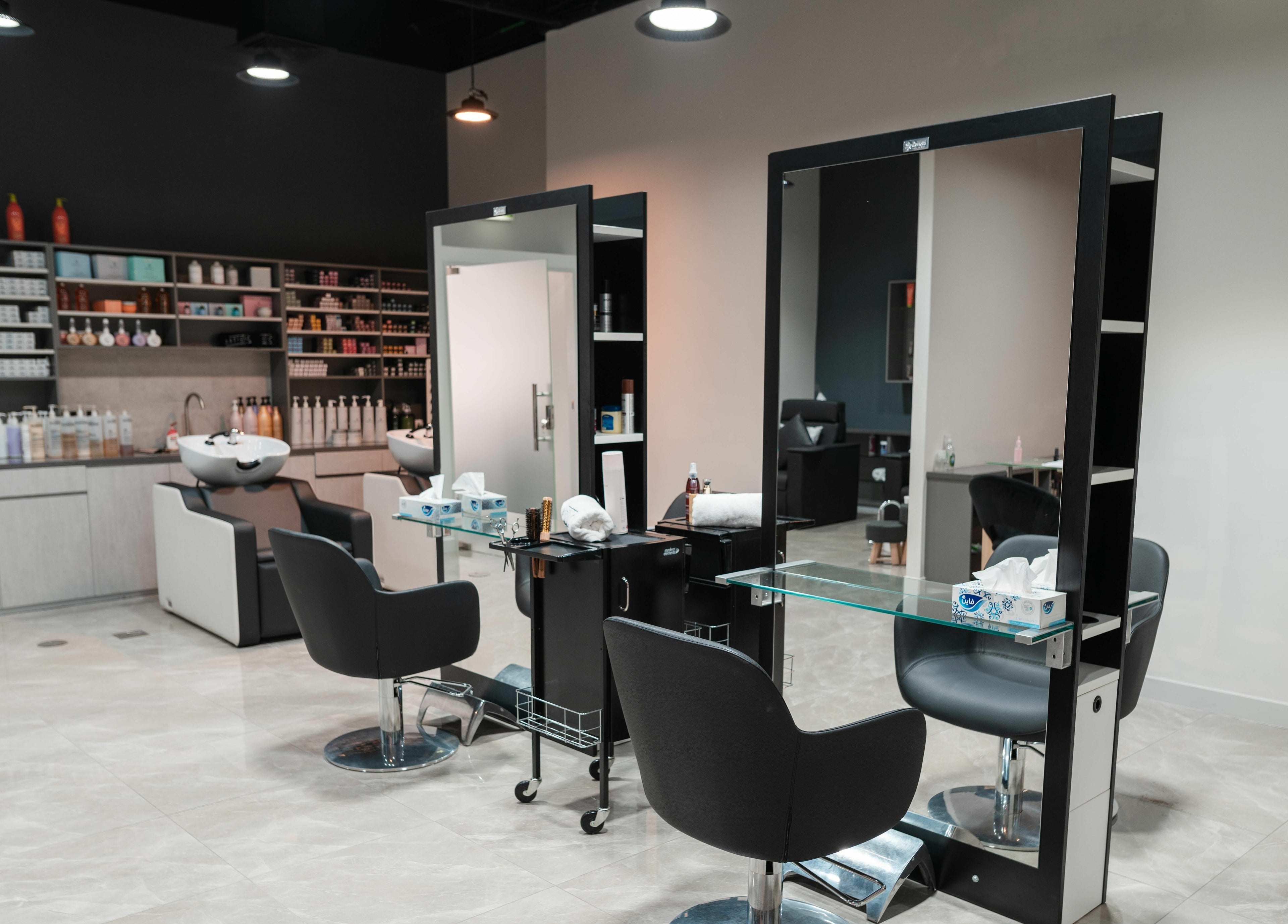 Contemporary salon interior at Artistic Trendz Hair and Beauty Salon, Dubai, AE, showcasing sleek styling stations.